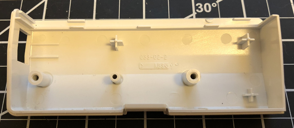 The inside of the plastic case of a Dreamcast modem